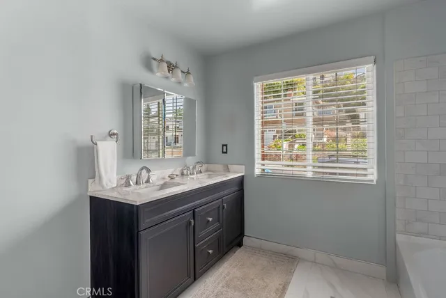 a a bathroom with a toilet a sink and a bathtub