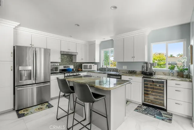 a large bedroom with a large bed and furniture