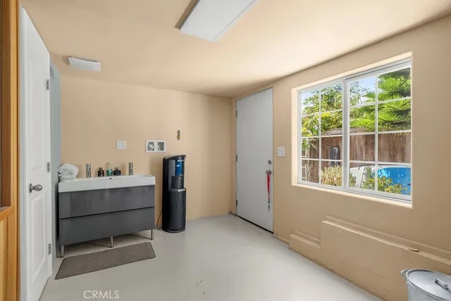 a view of a walk in closet and bathroom