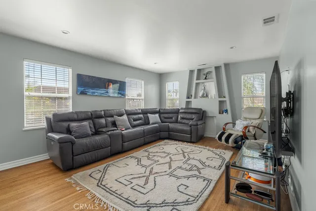 a view of a livingroom with furniture and wooden floor