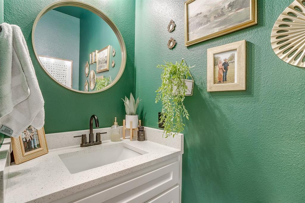 9720 Scenic View Court Rio Vista, TX 76093 - Photo 18 of 31 a bathroom with a sink and a mirror