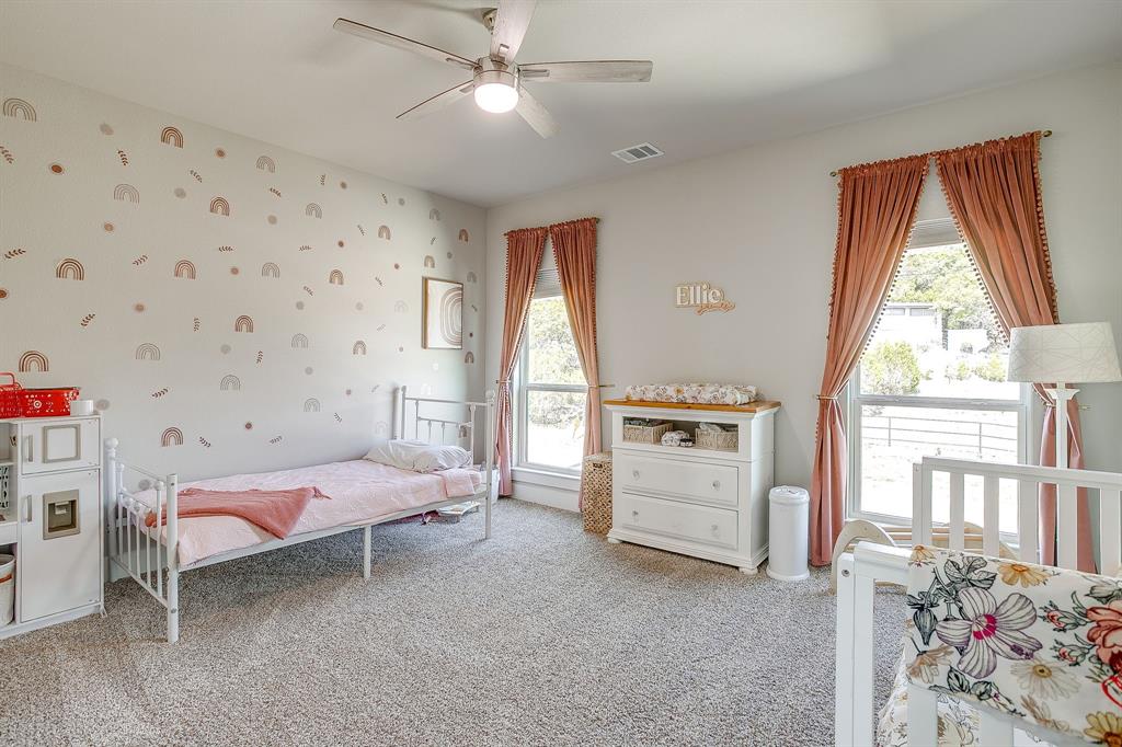 9720 Scenic View Court Rio Vista, TX 76093 - Photo 19 of 31 a bedroom with a bed and a window