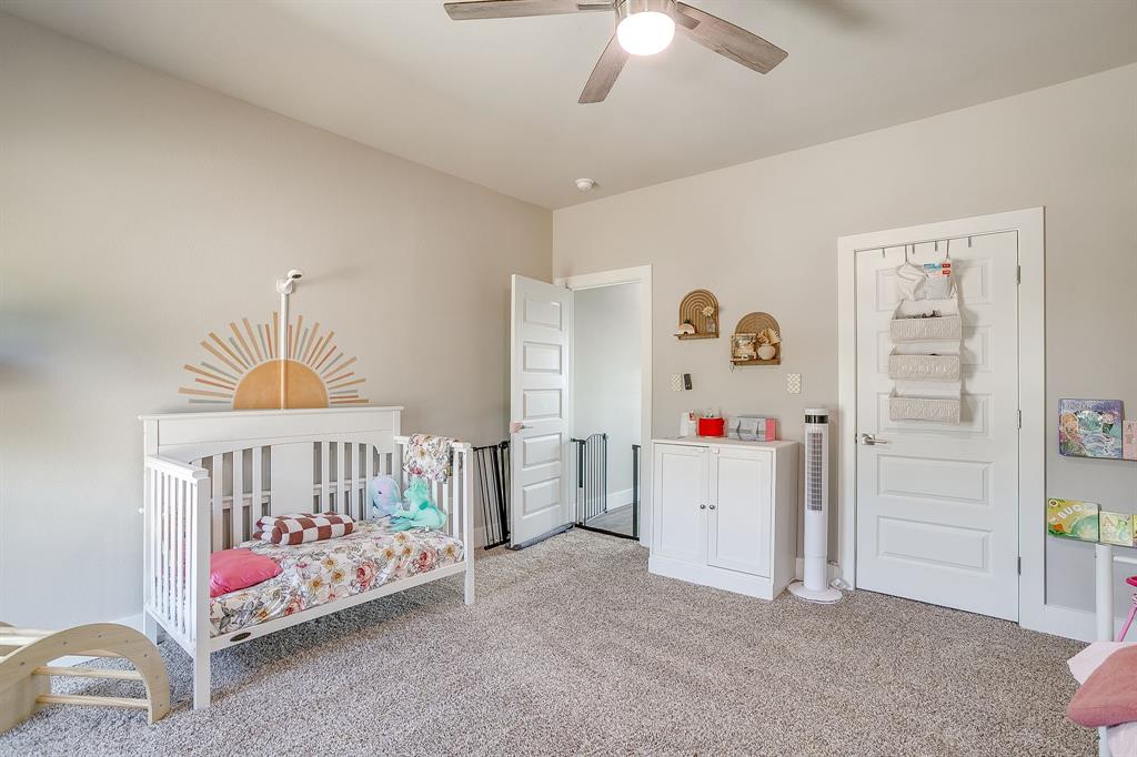 9720 Scenic View Court Rio Vista, TX 76093 - Photo 20 of 31 a bedroom with furniture and baby crib