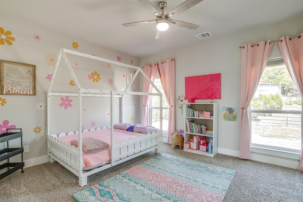 9720 Scenic View Court Rio Vista, TX 76093 - Photo 22 of 31 a bedroom with furniture and a window