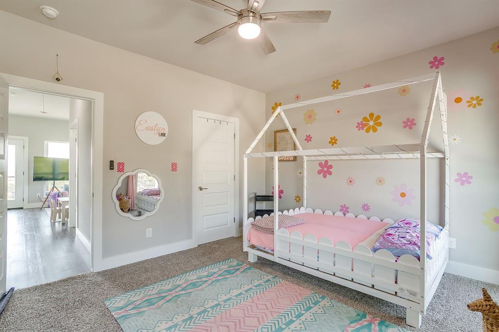 9720 Scenic View Court Rio Vista, TX 76093 - Photo 23 of 31 a bedroom with a bed and wooden floor