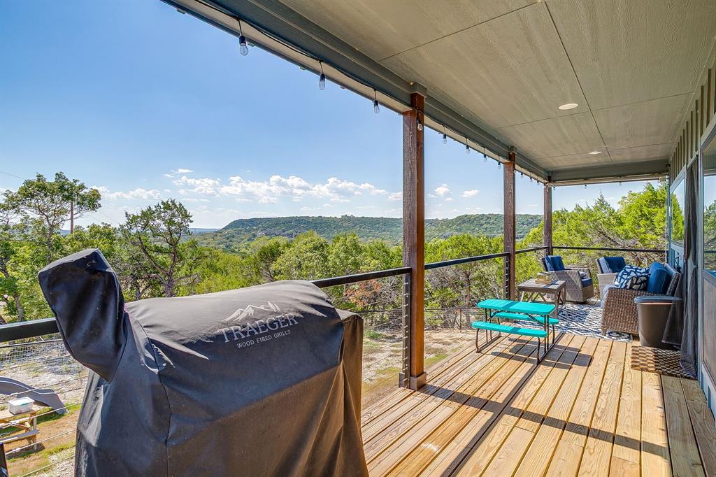 9720 Scenic View Court Rio Vista, TX 76093 - Photo 29 of 31 a view of balcony with couch and wooden floor