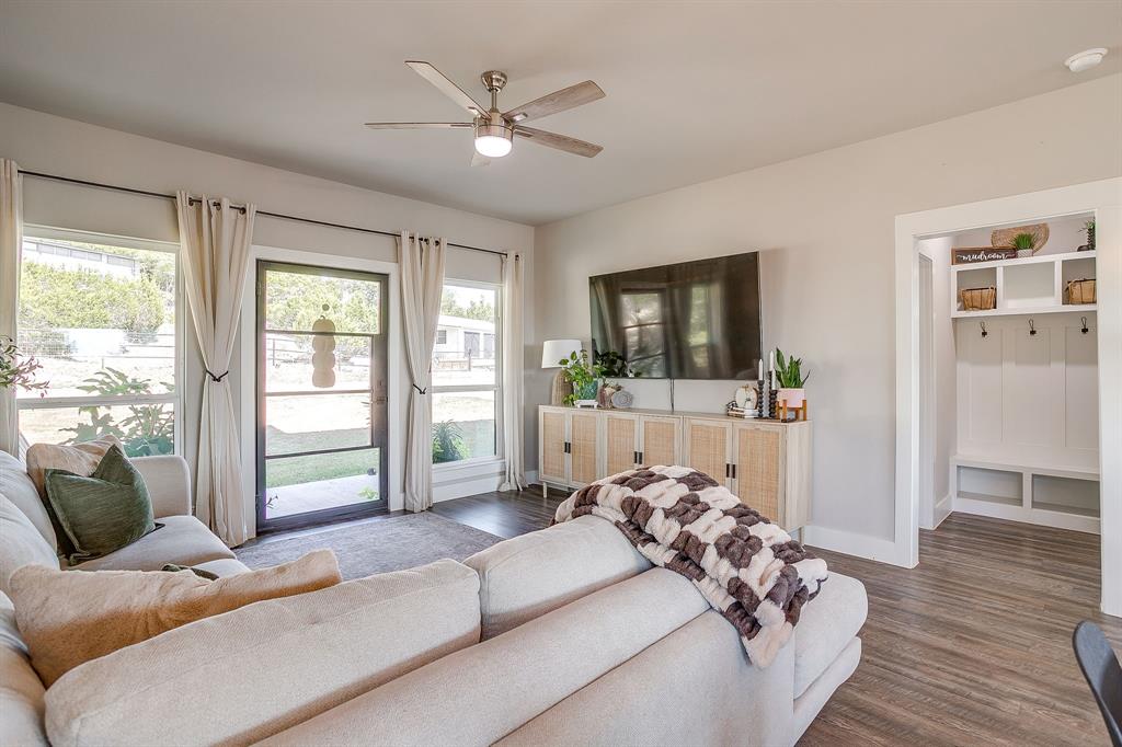 9720 Scenic View Court Rio Vista, TX 76093 - Photo 7 of 31 a living room with furniture and a flat screen tv