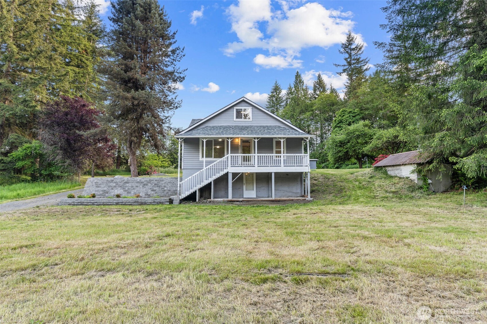 172 South Bank Road Elma, WA 98541 - Photo 3 of 40 a house with trees in the background