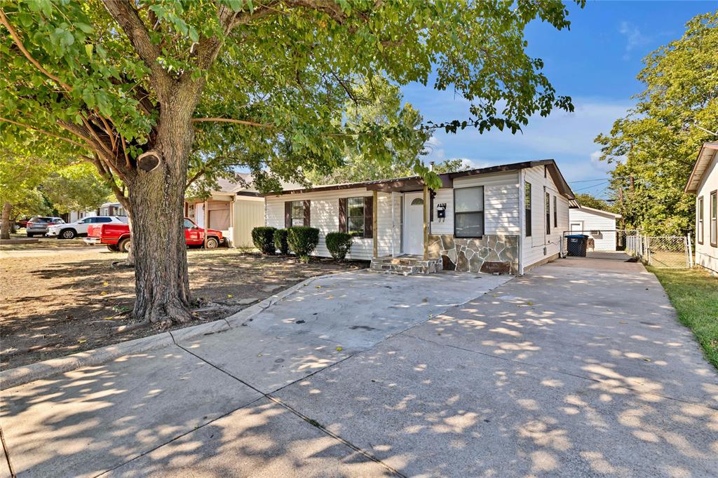 4120 Fry Street Fort Worth, TX 76115 - Photo 2 of 29 View of front facade featuring stone siding and driveway