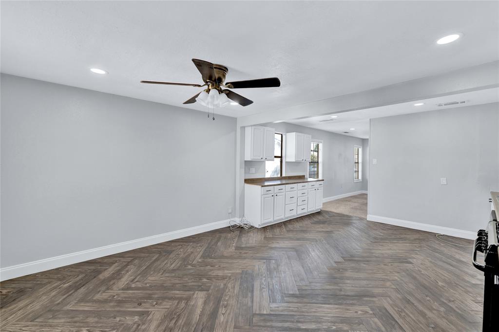 4120 Fry Street Fort Worth, TX 76115 - Photo 3 of 29 Unfurnished living room with recessed lighting and ceiling fan
