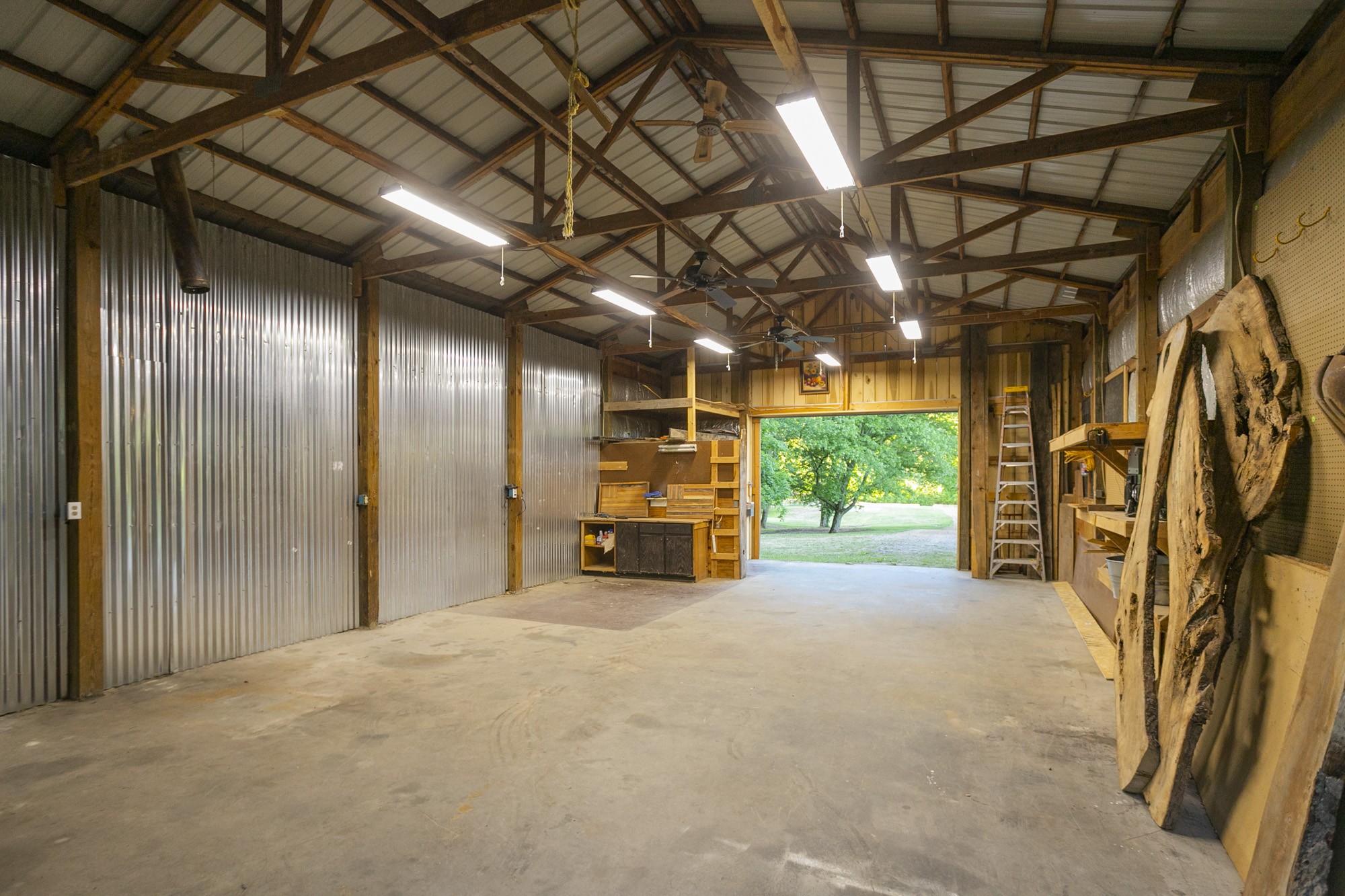 5750 Davis Hollow Road Franklin, TN 37064 - Photo 29 of 41 a view of empty room with wooden floor and fireplace