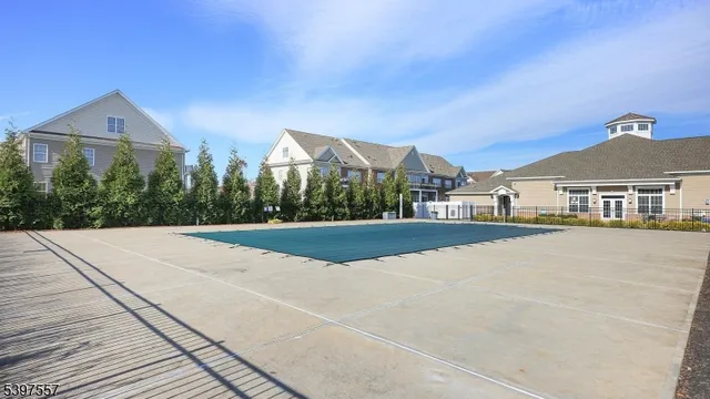 a view of house with yard and car parked