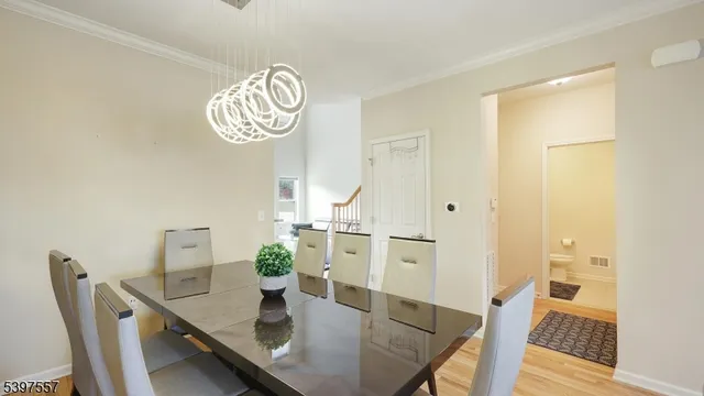 a view of kitchen and dining room with wooden floor
