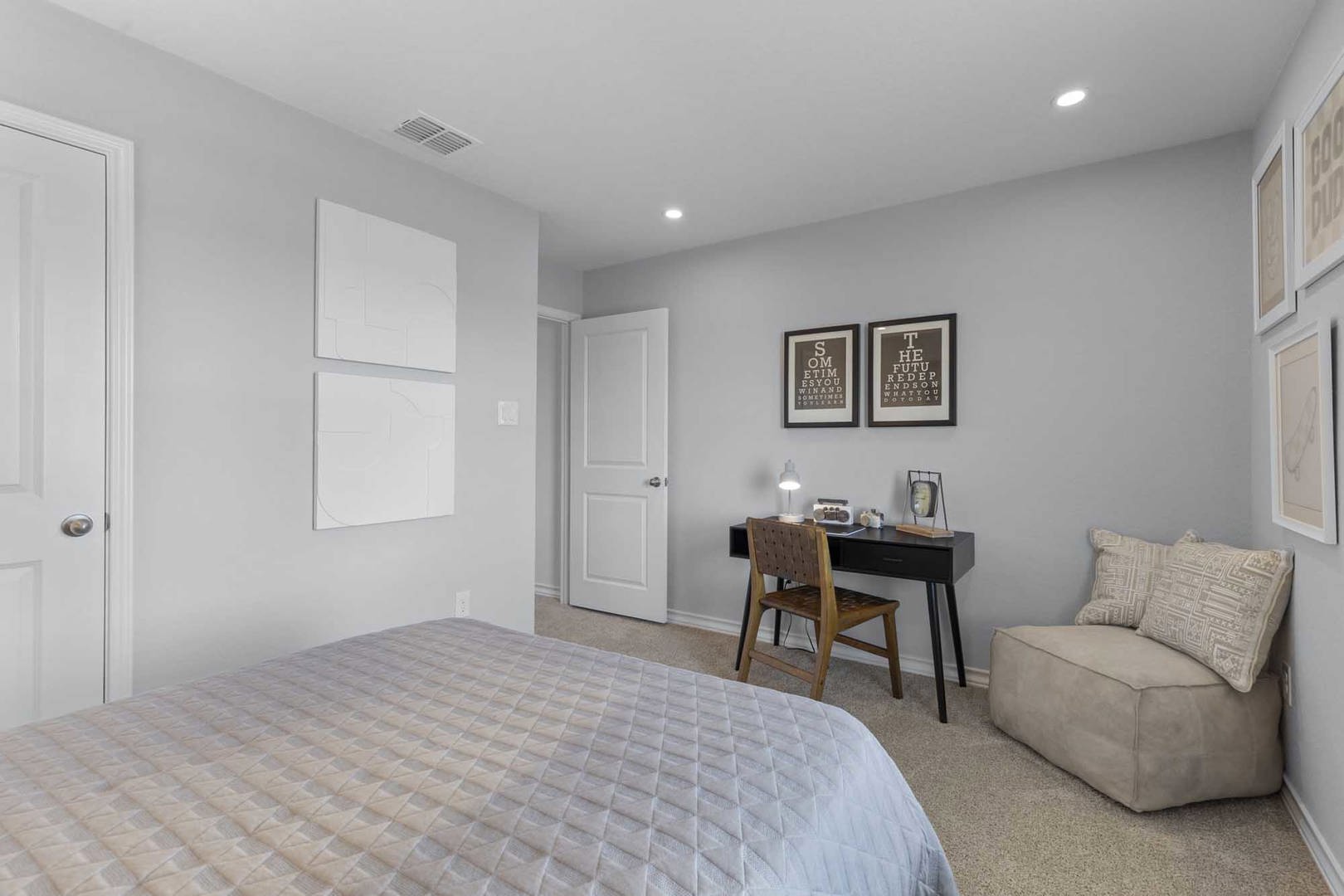105 Hatari Trail Jarrell, TX 76537 - Photo 19 of 27 Recessed lighting and soft wall tones highlight this bedroom with wall-to-wall carpeting.