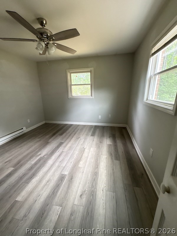 1051 Rulnick Street, Unit D Fayetteville, NC 28304 - Photo 1 of 5 wooden floor in an empty room with a window