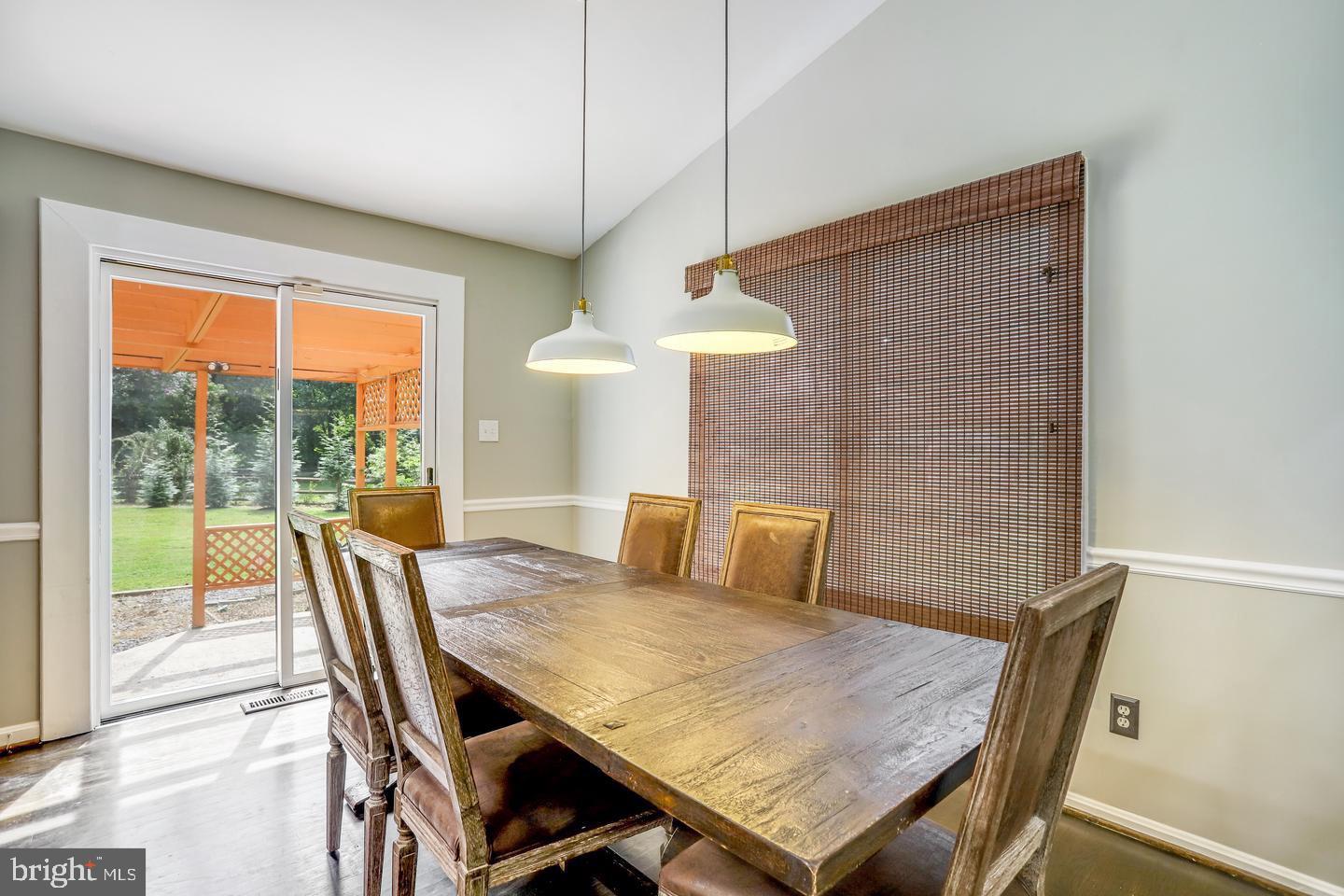 931 Welham Green Road Great Falls, VA 22066 - Photo 20 of 75 a view of a dining room with furniture window and outside view