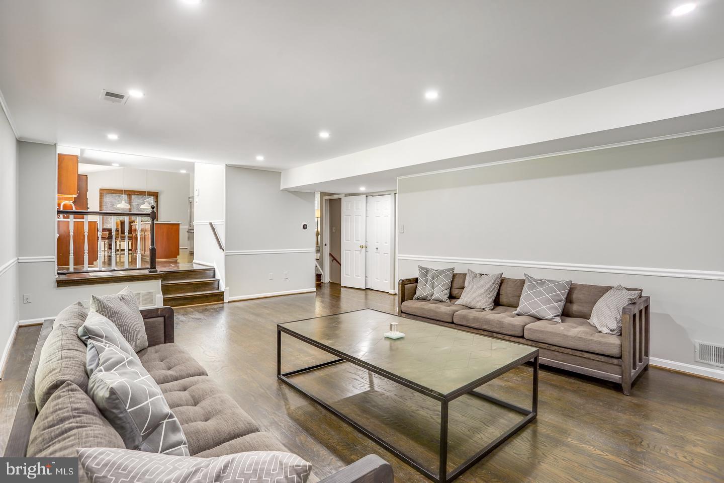 931 Welham Green Road Great Falls, VA 22066 - Photo 26 of 75 a living room with furniture and a table