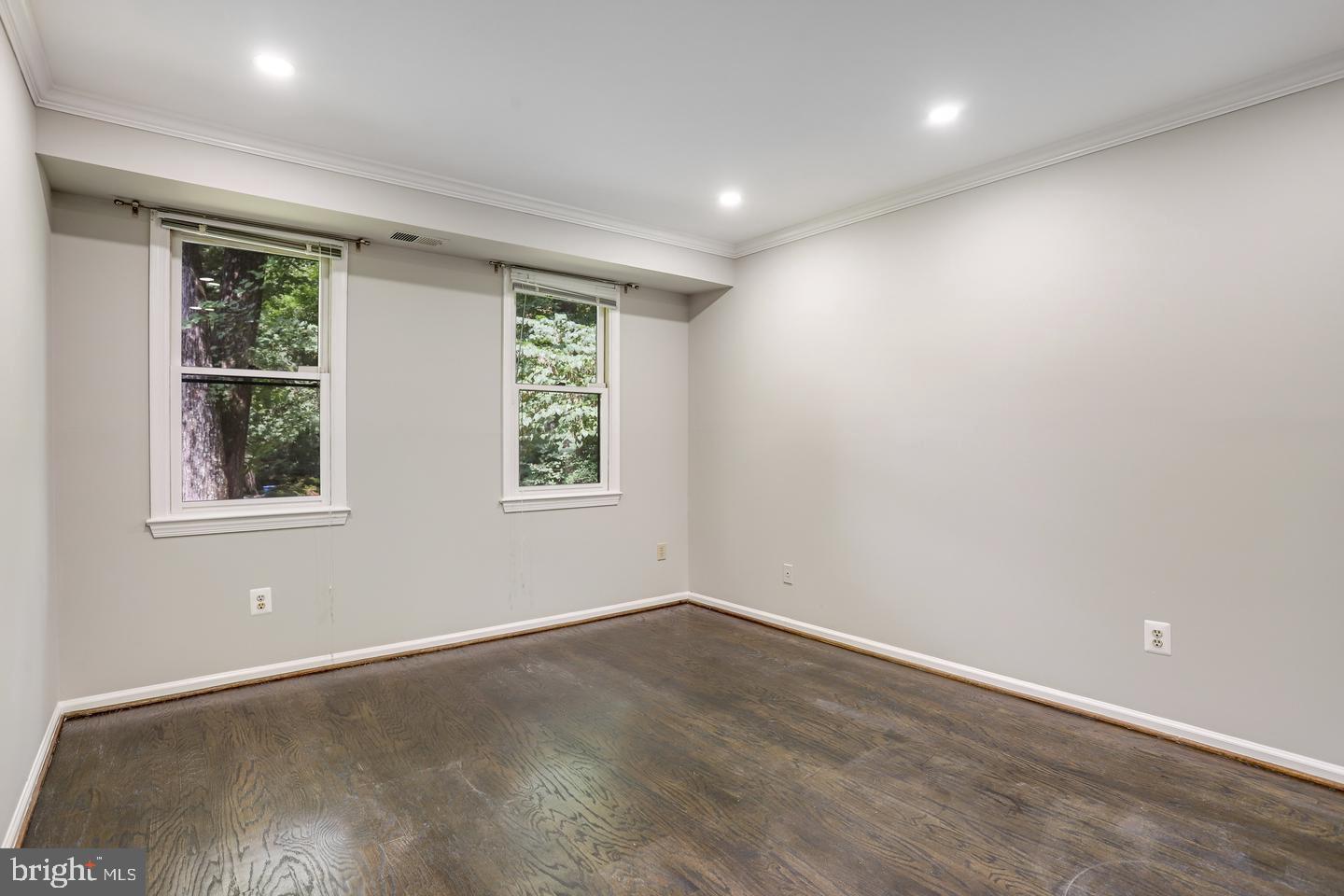 931 Welham Green Road Great Falls, VA 22066 - Photo 28 of 75 an empty room with wooden floor and windows