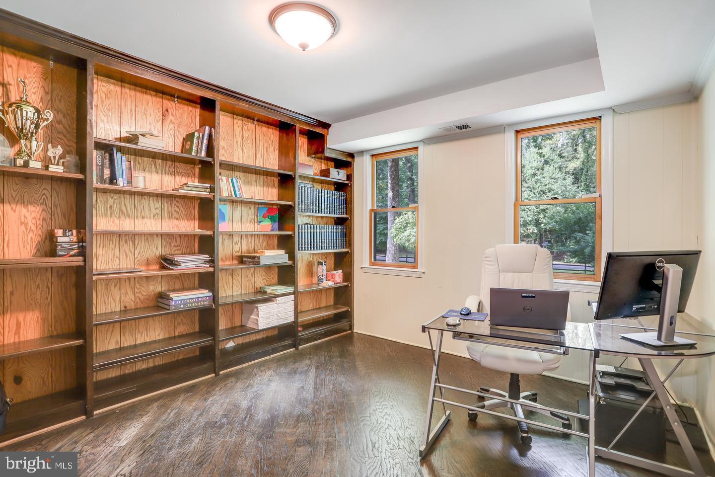 931 Welham Green Road Great Falls, VA 22066 - Photo 31 of 75 a view of a workspace with furniture and a window