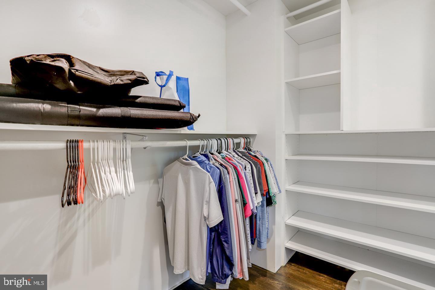 931 Welham Green Road Great Falls, VA 22066 - Photo 40 of 75 a view of walk in closet with clothes and shoes