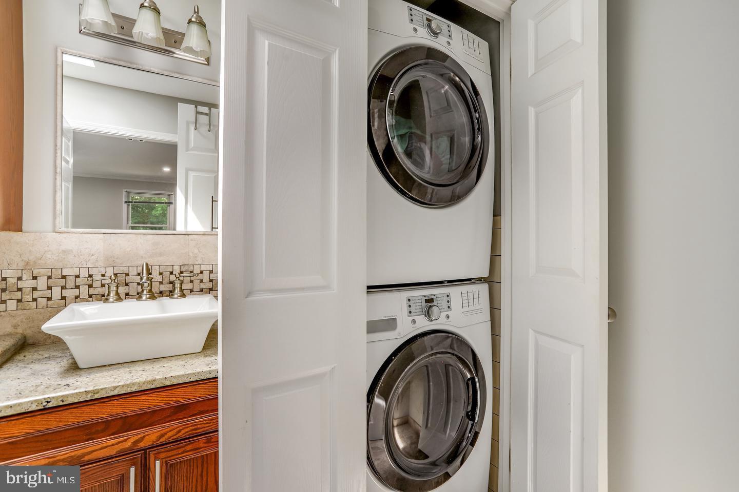931 Welham Green Road Great Falls, VA 22066 - Photo 46 of 75 a utility room with dryer and washer