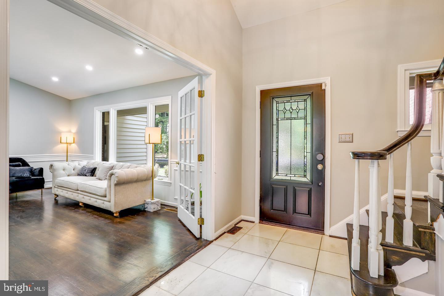 931 Welham Green Road Great Falls, VA 22066 - Photo 7 of 75 a living room with furniture and a large window