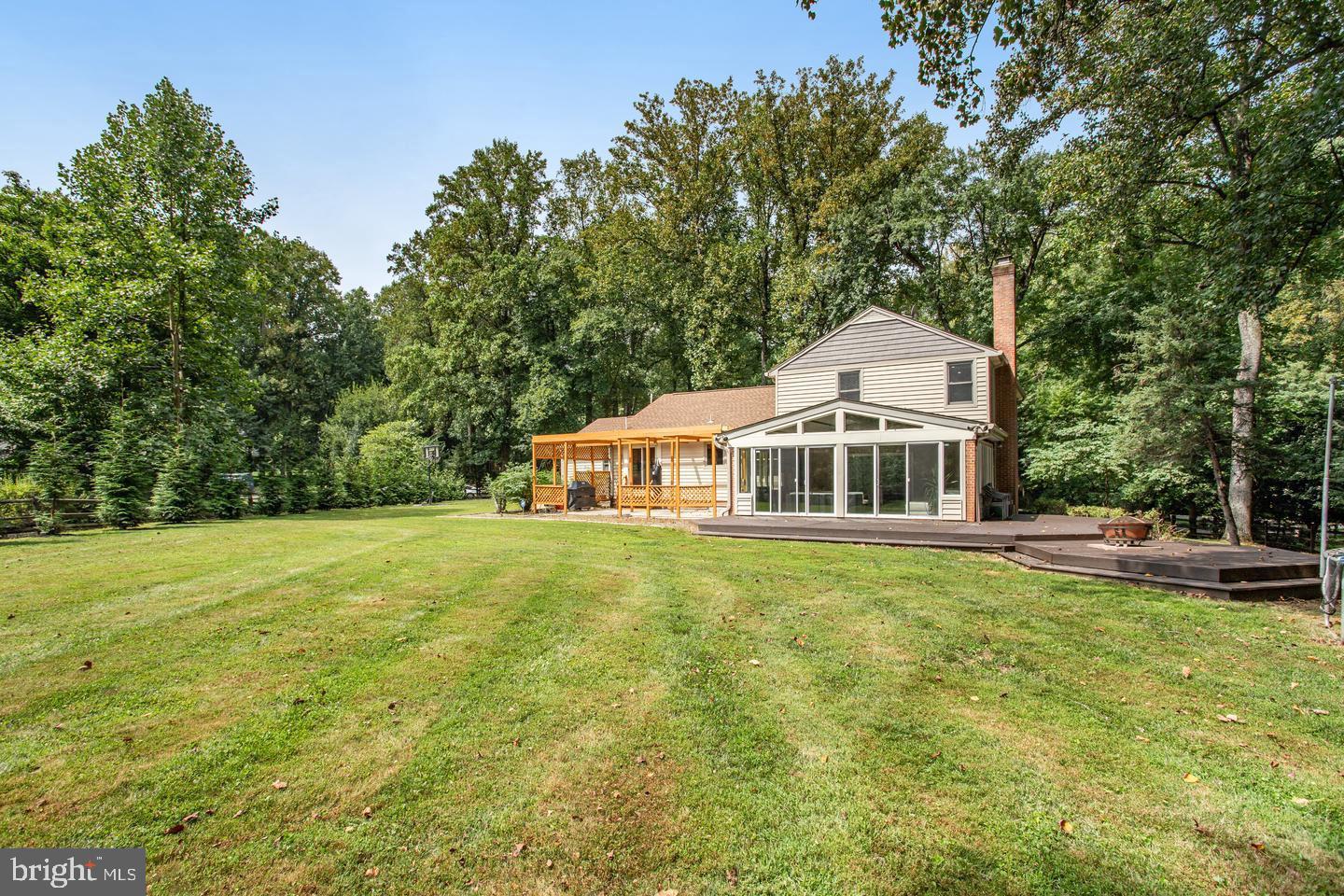 931 Welham Green Road Great Falls, VA 22066 - Photo 72 of 75 a view of a house with a yard and sitting area