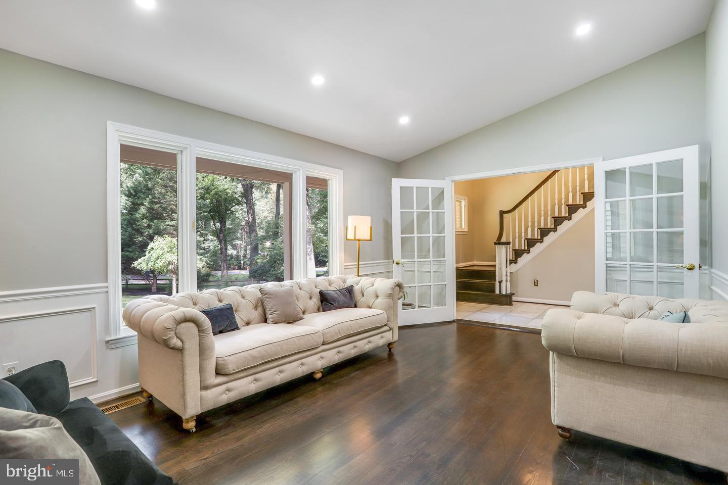 931 Welham Green Road Great Falls, VA 22066 - Photo 9 of 75 a living room with furniture and a large window