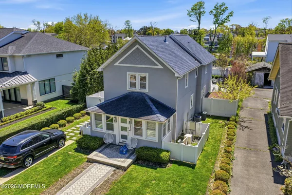 a aerial view of a house with a yard