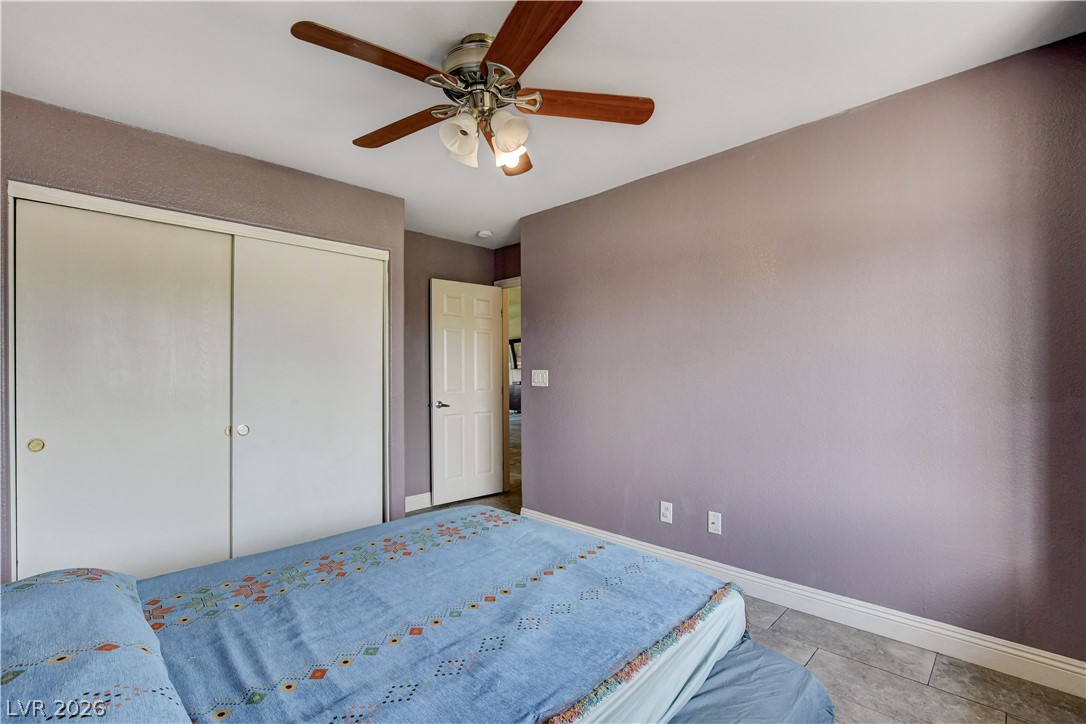 910 Cobblestone Cove Road North Las Vegas, NV 89081 - Photo 19 of 30 Relax in comfort with a ceiling fan overhead and convenient built-in closet storage.