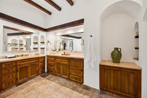 a bathroom with a toilet and a shower curtain