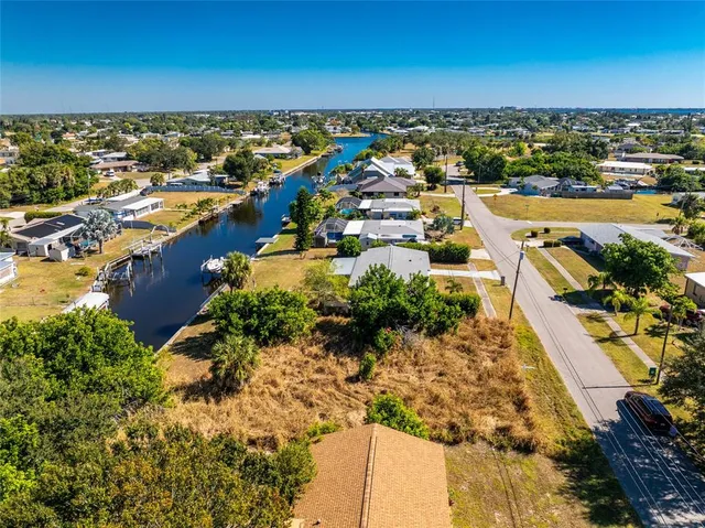 an aerial view of residential building and lake