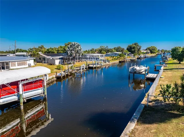 a view of swimming pool with outdoor seating