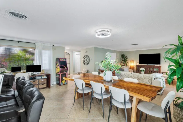 a view of a dining room with furniture window and outside view