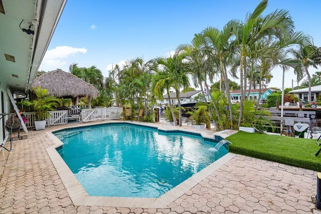 a view of a swimming pool with a patio