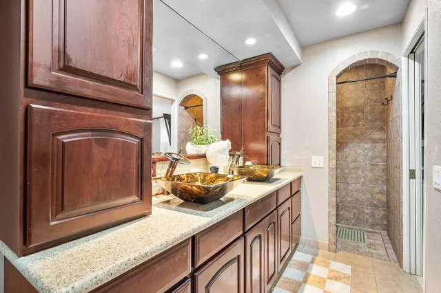 a bathroom with a sink a vanity and mirror
