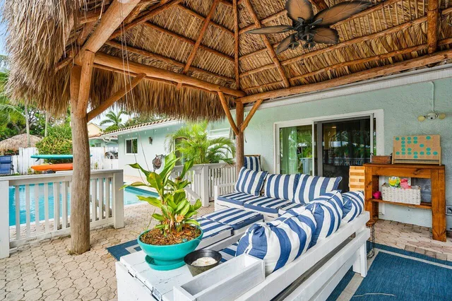 a view of a chairs and table in a patio