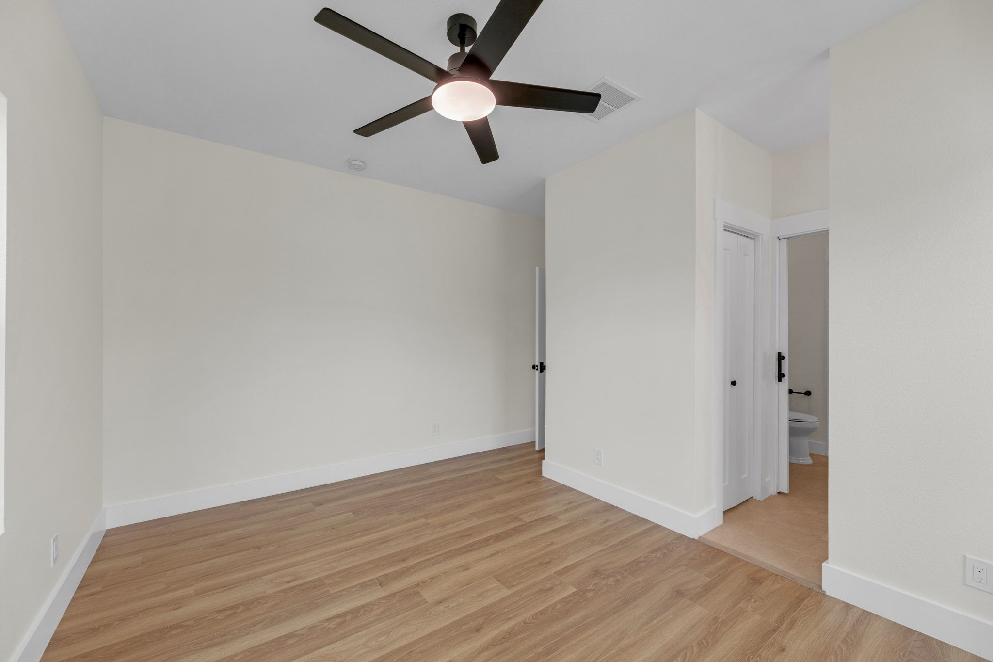 2102 South Church Street Georgetown, TX 78626 - Photo 15 of 40 Spare room with light wood-type flooring and a ceiling fan