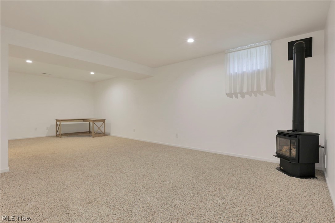 14953 King Road Howard, OH 43028 - Photo 25 of 40 Family room on basement level featuring gas heater