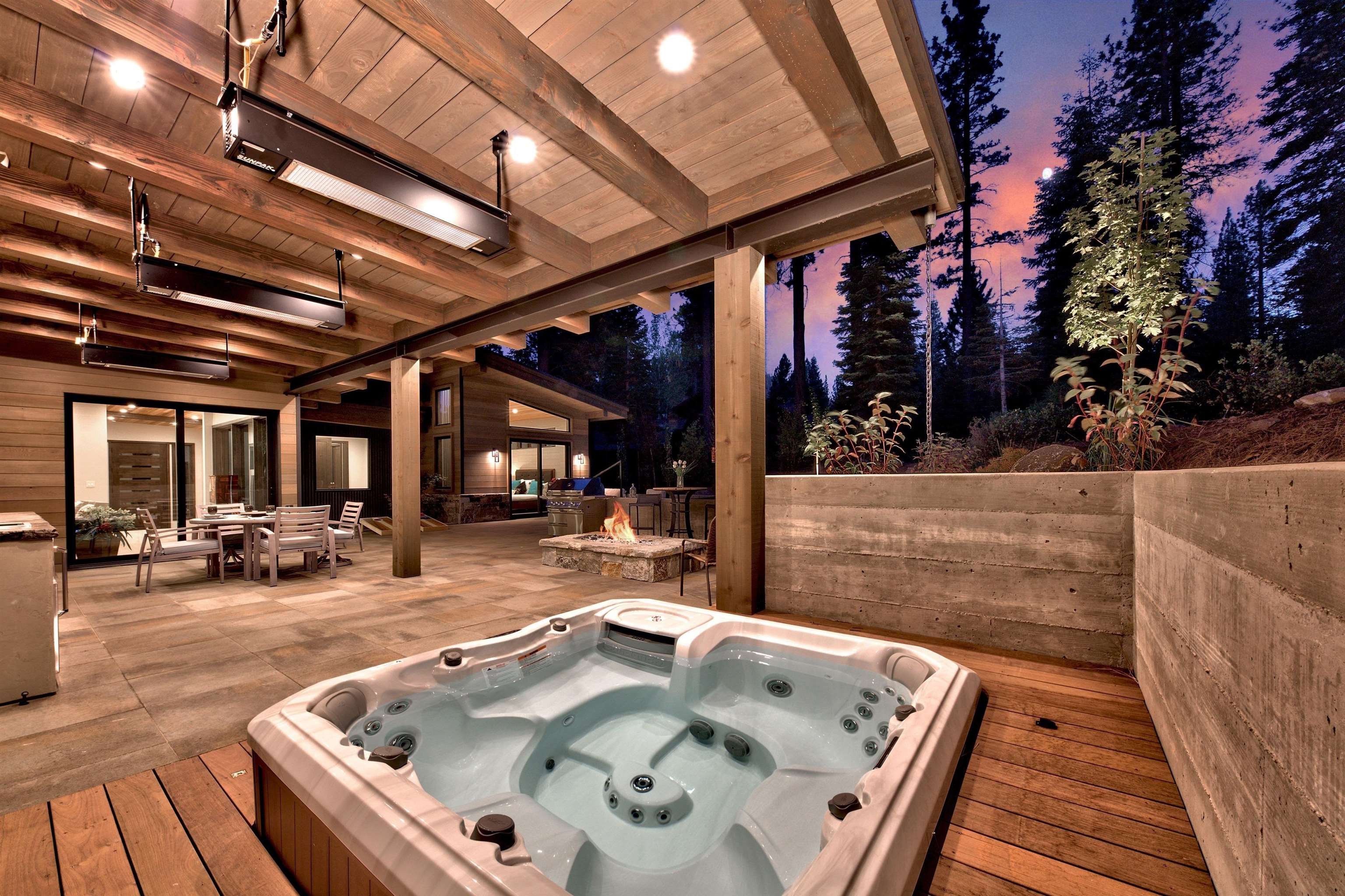 608 Ej Brickell Truckee, CA 96161 - Photo 13 of 20 a view of roof deck with table and chairs with wooden floor and fence