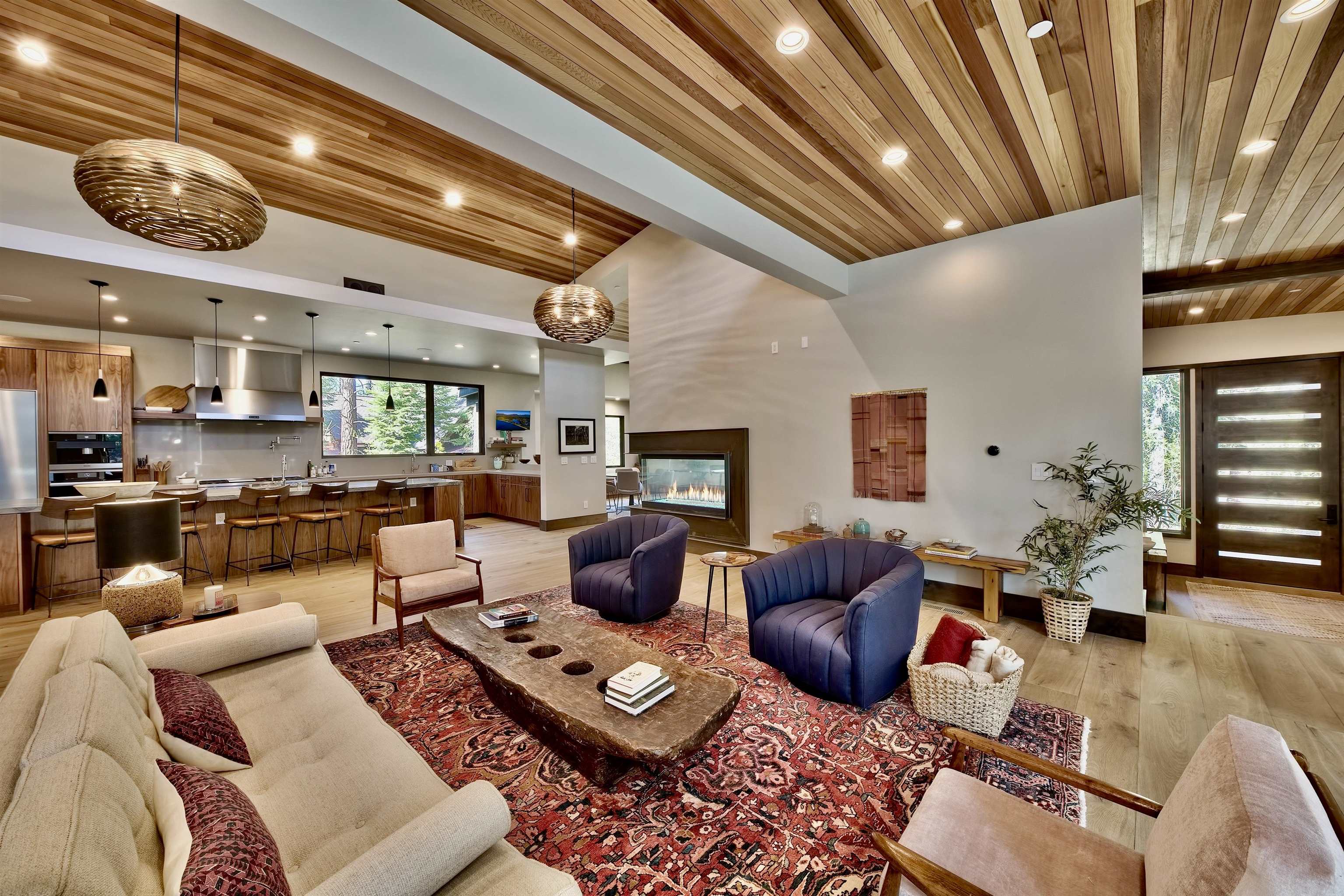 608 Ej Brickell Truckee, CA 96161 - Photo 2 of 20 a living room with furniture a fireplace and a chandelier