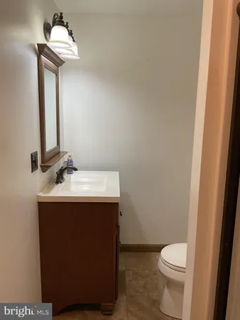 a bathroom with a shower and toilet