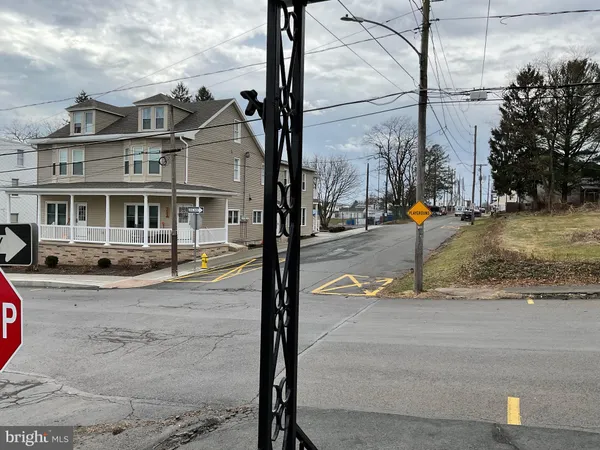 a view of a cars park in front of a building