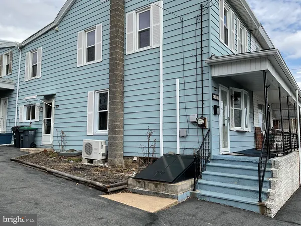 a front view of a house with stairs