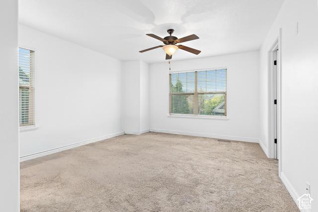 2092 Cres Drive South Mapleton, UT 84664 - Photo 12 of 26 Neutral carpet flooring, white walls, and a ceiling fan with integrated lighting