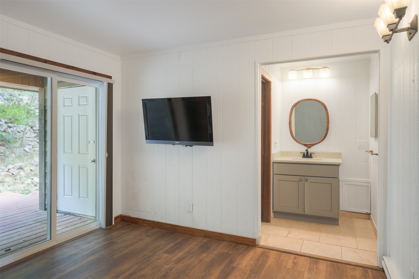 132 Illinois Gulch Road, Unit 3 Breckenridge, CO 80424 - Photo 9 of 32 a view of a bathroom with a sink and a mirror
