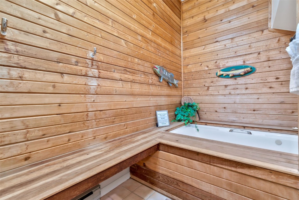 2025 Walton Creek Road, Unit 401 Steamboat Springs, CO 80487 - Photo 27 of 38 a view of wooden floor and bench