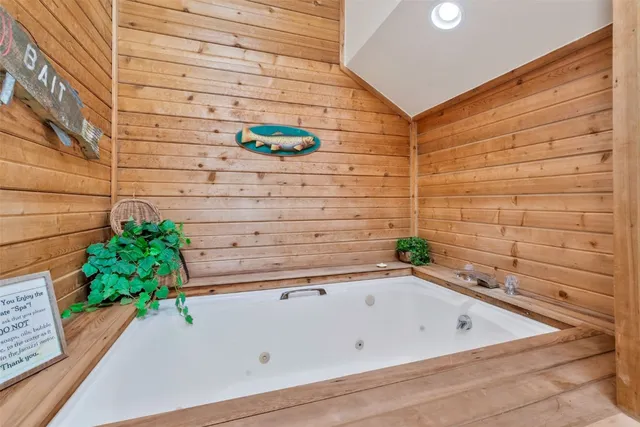 a bathroom with a bathtub and shower