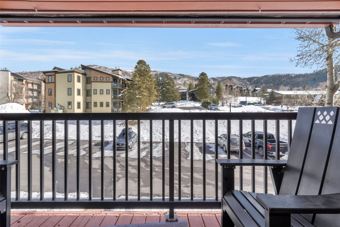 2025 Walton Creek Road, Unit 401 Steamboat Springs, CO 80487 - Photo 31 of 38 a view of a balcony with an outdoor space
