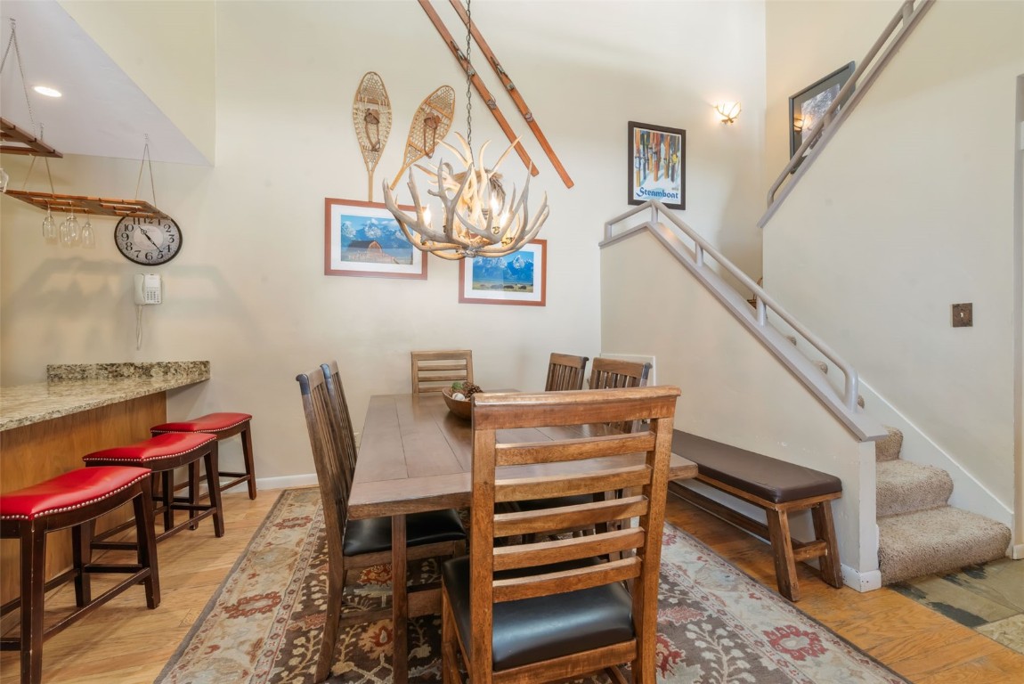 2025 Walton Creek Road, Unit 401 Steamboat Springs, CO 80487 - Photo 8 of 38 a view of a livingroom with furniture and a piano